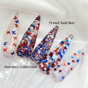 May include: Four nail polish bottles with red, white, and blue glitter. The bottles are labeled "Trend Nail Bar" and "Patriotic Collection".