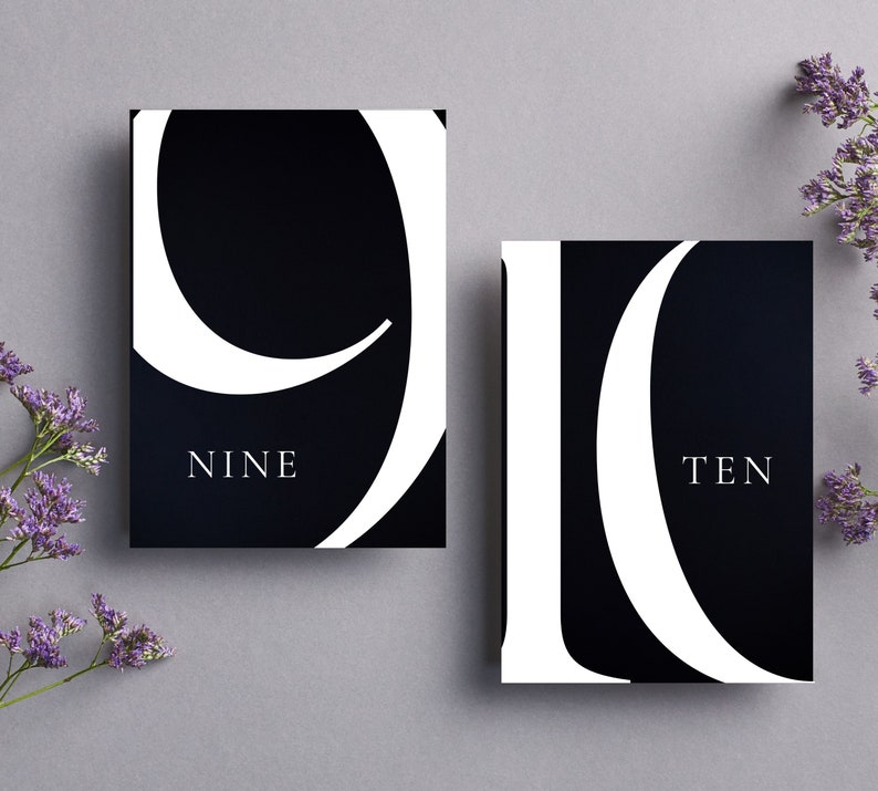 May include: Two black cards with white numbers and text. The first card has the number nine and the word "NINE" below it. The second card has the number ten and the word "TEN" below it.