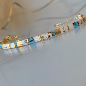 Blauwe en gouden kralenarmband voor dames, verstelbare Tila-armband, trendy platte kralenarmband