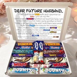 May include: A white gift box with a message for a future husband. The box is filled with a variety of chocolate bars, including Milky Way, Twirl, Wispa, Bounty, and Yorkie.