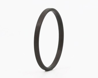 Black Carbon Couture: Exquisite Simplicity and Stackable Elegance - Unveiling the Thin Wedding Ring of Unmatched Comfort