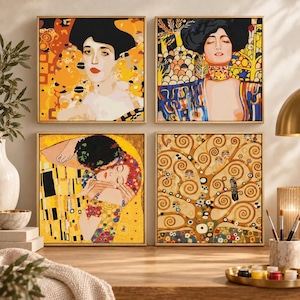 May include: A set of four square wall art prints featuring iconic Gustav Klimt paintings. The collection includes portraits of women, a couple embracing, and a stylised tree of life, all rendered in vibrant gold, yellow, blue, and black tones.