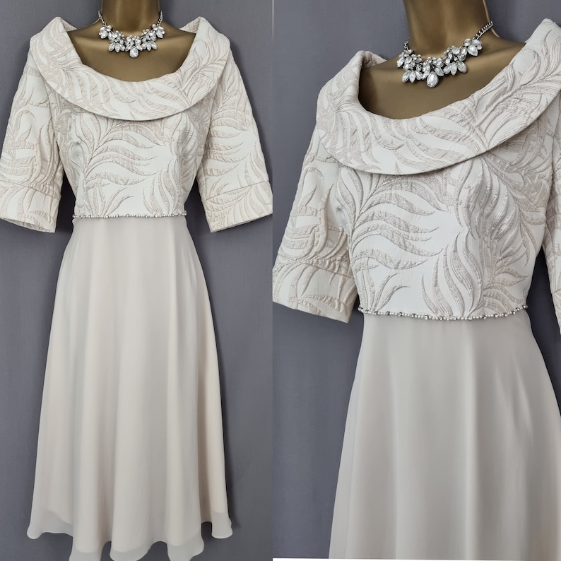 Mother of the bride / Groom dress from designer Lizabella is in a beautiful Champagne gold colour,

Signature dresses has selected this piece as a perfect item for a wedding, christening, or any special event.