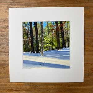 May include: A painting of a snowy forest scene with tall trees and long shadows. The trees are bare and the ground is covered in white snow. The sun is shining brightly and the sky is a clear blue.