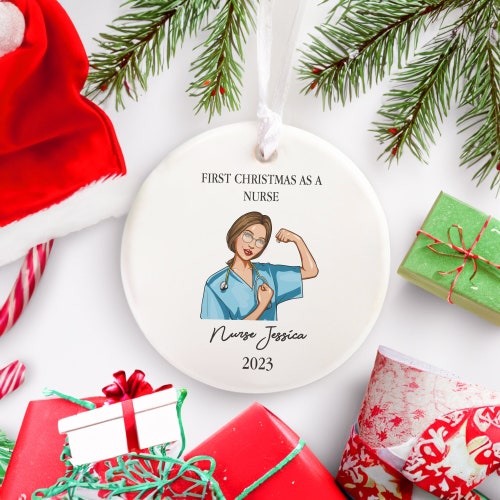 First Christmas as a Nurse Christmas Ornament, RN BSN Nursing School Graduation Gift, New Nurse Daughter Keepsake, Real Heroes Wear Scrubs