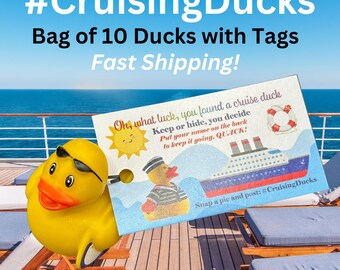 May include: A yellow rubber duck with sunglasses is on a wooden deck with a blue and white cruise ship in the background. The duck has a tag attached to it that says "Oh, what luck, you found a cruise duck. Keep or hide, you decide. Put your name on the back to keep it going. QUACK!" and has a picture of a cruise ship and a life preserver. The tag also says "Snap a pic and post: #CruisingDucks".