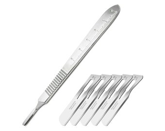 May include: A silver surgical scalpel handle with a ruler on the side and five silver surgical blades labeled "11" with the text "SWANN-MORTON ENGLAND  STERILE  11  1000"