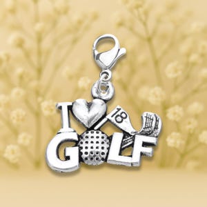May include: Silver charm with the words "I love golf" and a golf ball, club, and flag. The charm has a lobster clasp.