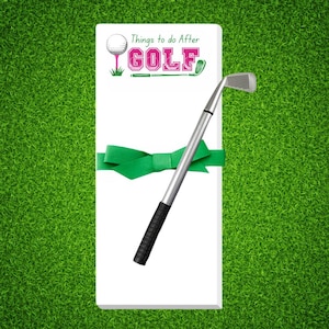 May include: A white notepad with the text "Things to do After GOLF" in pink and green, tied with a green ribbon. A golf club is placed across the notepad. The background is green.