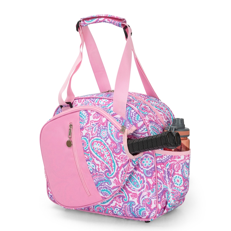 May include: Pink paisley patterned sports bag with a separate compartment for a racket and a side pocket for a water bottle.