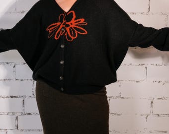Stylish cashmere // this sweater is unique features two patterns color combination black and orange made from 100% cashmere one-of-a-kind