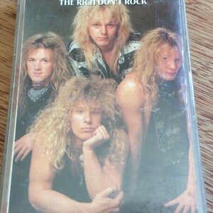 May include: A cassette tape featuring a band photo of four men with long hair. The band is called "VAMP" and the album title is "THE RICH DON'T ROCK".