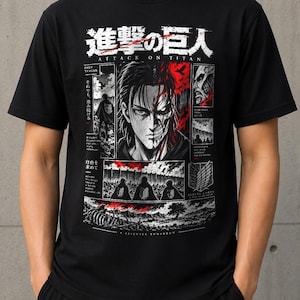 May include: A black short-sleeved t-shirt featuring a graphic print from Attack on Titan. The design includes the Japanese title, a split-face character illustration, scenes of soldiers, the Survey Corps emblem, and red accents on a dark background.