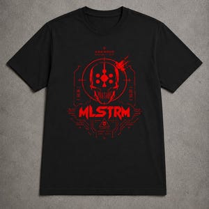 May include: A black short-sleeve t-shirt featuring a red graphic print of a stylized skull centered within a circular target design. The text MLSTRM is printed in bold red letters below the skull, accompanied by geometric lines and Japanese characters.