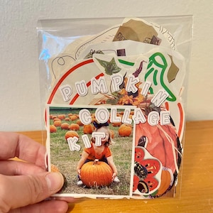 May include: A clear plastic bag containing a pumpkin collage kit. The kit includes various paper cutouts with autumn themes, including a photograph of a child holding a pumpkin in a field, and the text PUMPKIN COLLAGE KIT in white letters.