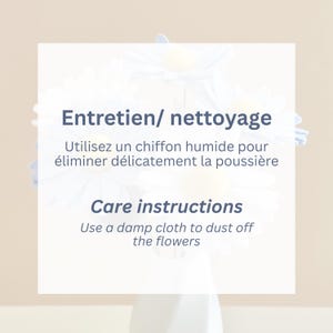 May include: A white square sign with dark blue text that reads Entretien/ nettoyage Utilisez un chiffon humide pour &eacute;liminer d&eacute;licatement la poussi&egrave;re and Care instructions Use a damp cloth to dust off the flowers, set against light blue flowers.