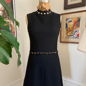 Black 60s shift / Mad Men-style black cocktail dress with gold details