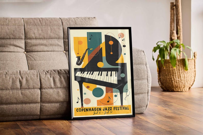 May include: A black framed poster with a colorful abstract design featuring a piano, musical notes, and the text "Copenhagen Jazz Festival Jul 5 - Jul 14".