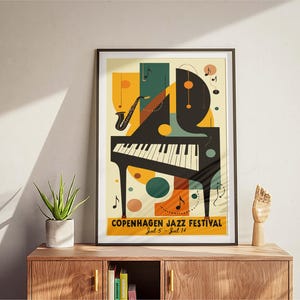 May include: A retro-style poster for the Copenhagen Jazz Festival, featuring a black grand piano with a saxophone, musical notes, and geometric shapes in shades of yellow, green, orange, and brown. The text reads "Copenhagen Jazz Festival, Jul 5 - Jul 14."