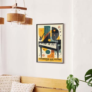 May include: A colorful poster with an abstract design featuring a piano, musical notes, and the text "Copenhagen Jazz Festival" in black and white.