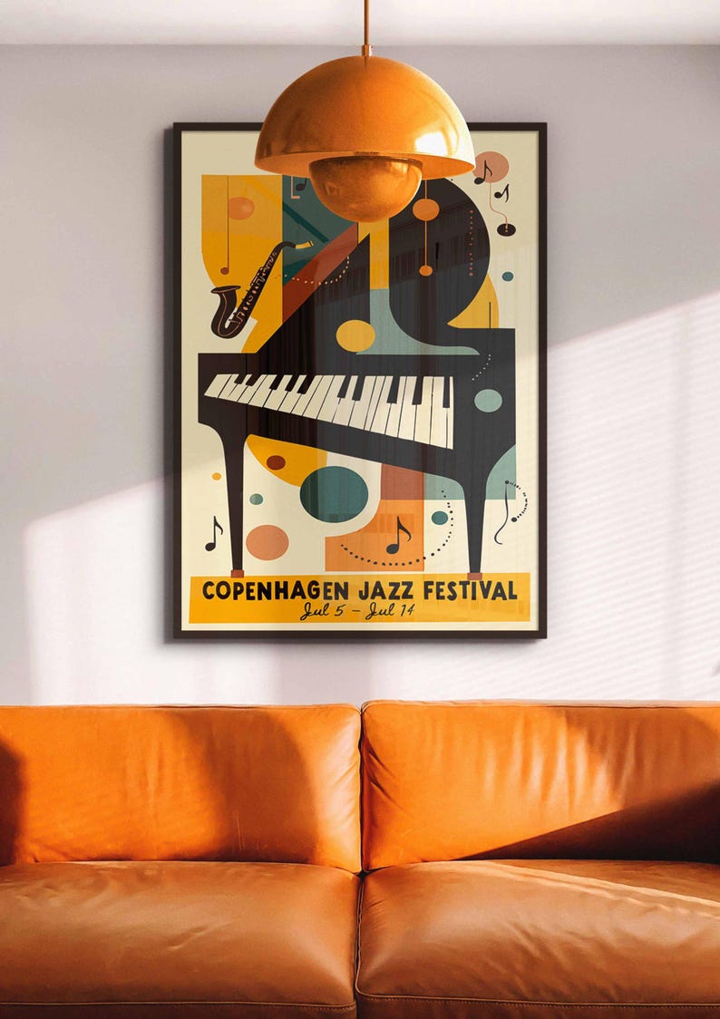 May include: A vintage-style poster for the Copenhagen Jazz Festival, featuring a black grand piano, a saxophone, and musical notes in a colorful abstract design. The poster is framed in black and has the text "Copenhagen Jazz Festival Jul 5 - Jul 14".