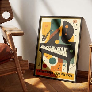 May include: A retro-style poster for the Copenhagen Jazz Festival, featuring a black piano with white keys, a saxophone, and colorful abstract shapes. The text reads "Copenhagen Jazz Festival Jul 5 - Jul 14".
