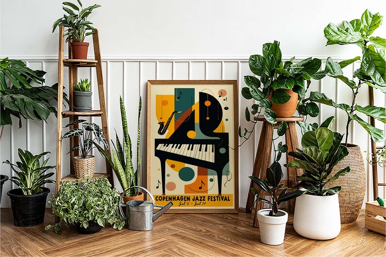 May include: A colorful poster with a stylized piano and saxophone, featuring the text "Copenhagen Jazz Festival" and the dates "July 8 - July 14". The poster is framed and hanging on a white wall, surrounded by potted plants.