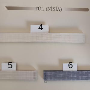 Puede incluir: La imagen muestra tres muestras de molduras texturizadas, etiquetadas como 4, 5 y 6. Las molduras son en tonos blanco, beige y gris. El texto "T&Uuml;L (NİSİA)" est&aacute; en la parte superior. Las muestras rectangulares parecen ser para la decoraci&oacute;n del hogar.