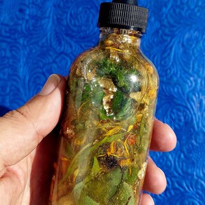 Money Ritual Oil, spell Prosperity Conjure Oil with Herbs, Gems, Gold Leaf 4oz Dropper Bottle Wealth Attraction Hoodoo Oil handmade money drawing ritual oil, afro atlantic prosperity conjure blend, wealth attraction feng shui rootwork oil, handcrafted spell oil with herbs and stones, 24k gold leaf magical abundance oil, magick intention oil for money success, financial prosperity ritual anointing oil money drawing oil, conjure hoodoo, prosperity spell oil, wealth ritual oil, rootwork abundance