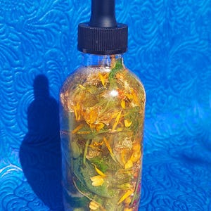 Money Ritual Oil, spell Prosperity Conjure Oil with Herbs, Gems, Gold Leaf 4oz Dropper Bottle Wealth Attraction Hoodoo Oil handmade money drawing ritual oil, afro atlantic prosperity conjure blend, wealth attraction feng shui rootwork oil, handcrafted spell oil with herbs and stones, 24k gold leaf magical abundance oil, magick intention oil for money success, financial prosperity ritual anointing oil money drawing oil, conjure hoodoo, prosperity spell oil, wealth ritual oil, rootwork abundance