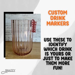 May include: A tall, ribbed, pink glass with a red drink marker that says "SHAWN." The image also includes the text "CUSTOM DRINK MARKERS" and "USE THESE TO IDENTIFY WHICH DRINK IS YOURS OR JUST TO MAKE THEM MORE FUN!"