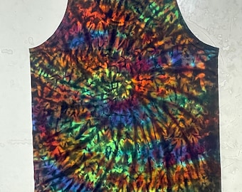 May include: A sleeveless tank top with a vibrant tie-dye pattern. The colors include shades of green, orange, purple, and blue, creating a swirling, psychedelic design. The top has a scoop neck and is made of a soft material.