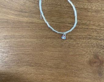 Silver long round bead with gems