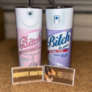 May include: Two white stainless steel tumblers with black straws. One is pink with the word "Bitch" in cursive, the other is purple with the words "Bitch be gone". Both have a spray bottle design. Business cards are in front.