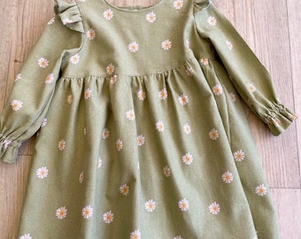 Handmade little girls winter dress in a soft pale green cord fabric