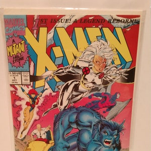 May include: A comic book cover featuring the X-Men. The cover is red, yellow, and blue with a large X in the centre. The characters Storm, Beast, and Jean Grey are featured on the cover. The text on the cover reads "1st Issue! A Legend Reborn!" and "A Mutant Mile Stone!"