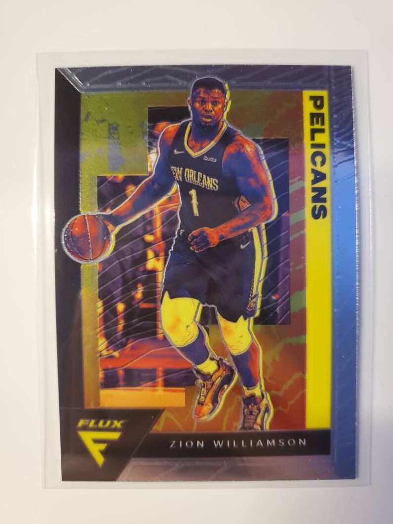 May include: A basketball trading card featuring Zion Williamson of the New Orleans Pelicans. The card has a yellow, blue, and black background with a holographic effect. The card features a photo of Williamson dribbling the ball. The card is from the Flux series.