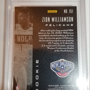 May include: A black and gold basketball trading card featuring Zion Williamson of the New Orleans Pelicans. The card is from the 2019-20 Panini Illusions Basketball set. The card number is 151.