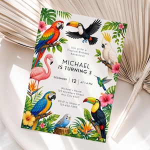 May include: A rectangular birthday invitation card featuring colorful tropical birds including a macaw, toucan, cockatoo, flamingo, hummingbird, and parakeet, surrounded by hibiscus flowers and palm leaves, with text detailing a party for Michael.
