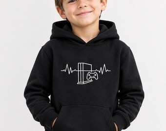 May include: A black long-sleeve hooded sweatshirt featuring a white graphic print on the chest. The design displays a heartbeat line pattern that incorporates a gaming console and a controller. The hoodie includes a front kangaroo pocket.