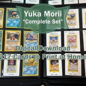 May include: A collection of 217 Pokémon trading cards, arranged in a black binder. The cards display various colourful illustrations and text, with the words "Yuka Morii Complete Set" and "Digital Download" visible. The cards are designed to be printed at home.