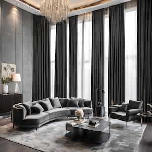 May include: A curved grey velvet sofa with multiple cushions sits in a modern living room with large windows and grey curtains. A black coffee table with a glass top sits in front of the sofa. A grey armchair with gold legs sits to the right of the sofa.