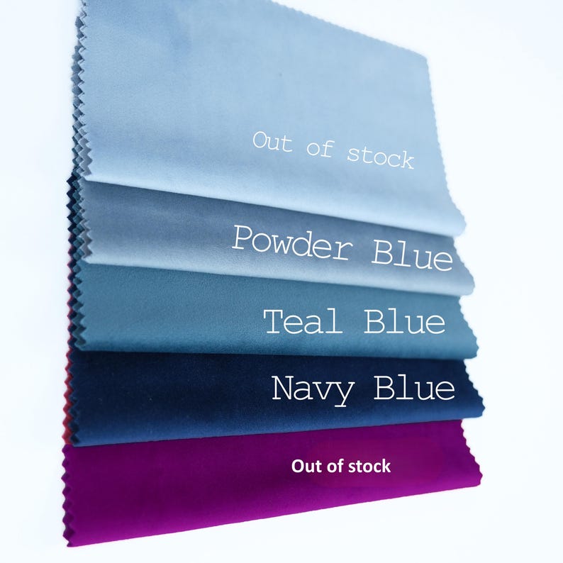 May include: A stack of five rectangular fabric swatches with pinked edges, featuring colors labeled as Out of stock, Powder Blue, Teal Blue, Navy Blue, and Out of stock. The fabric has a smooth, matte finish and is arranged in a vertical column.