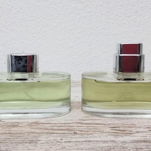 Must pour Homme Cartier EDT (eau de toilette) 2 Bottles 100ml = 200ml. Use the same vaporizer for both. SEE PICTURES!