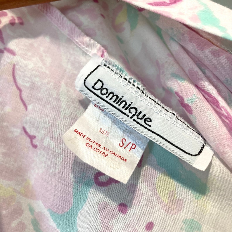 May include: White tag with black text that reads "Dominique" and "S/P". The tag also has the text "Made in/Fab. Au Canada CA 00182" and the number "8678".