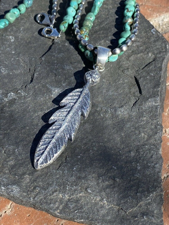 Navajo Sterling Silver Tufa Cast Feather