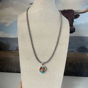 Colgante Zuni de plata de ley con incrustaciones de múltiples piedras