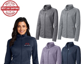 May include: Four women's fleece jackets in different colors: heather gray, navy blue, purple, and dark blue. The jackets have a zipper closure, two front pockets, and a stand-up collar. The navy blue jacket has an embroidered logo that says "CRNA, BSN, RN".