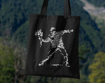 バンクシー風の風船と月を持つ少女のストリートアート / オーガニック