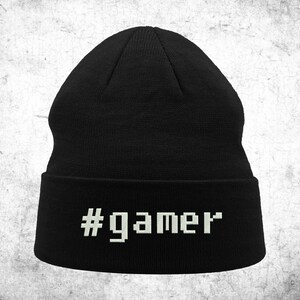 May include: Black beanie with a white pixelated #gamer text on the cuff.